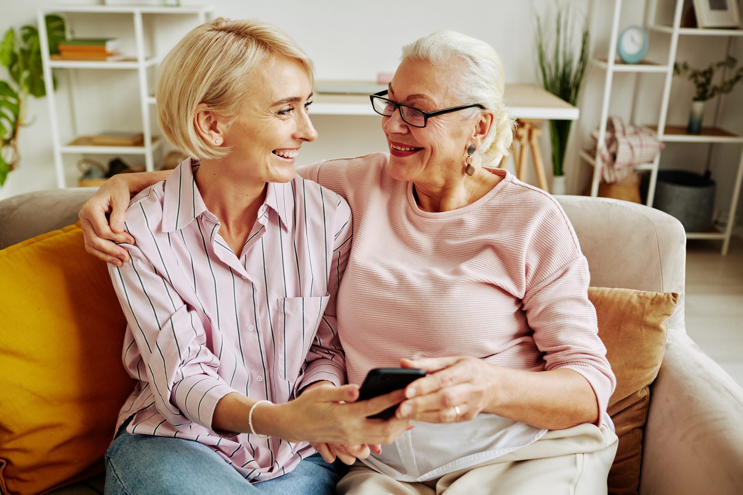 Happy Senior Woman with Adult Daughter after getting a reverse mortgage